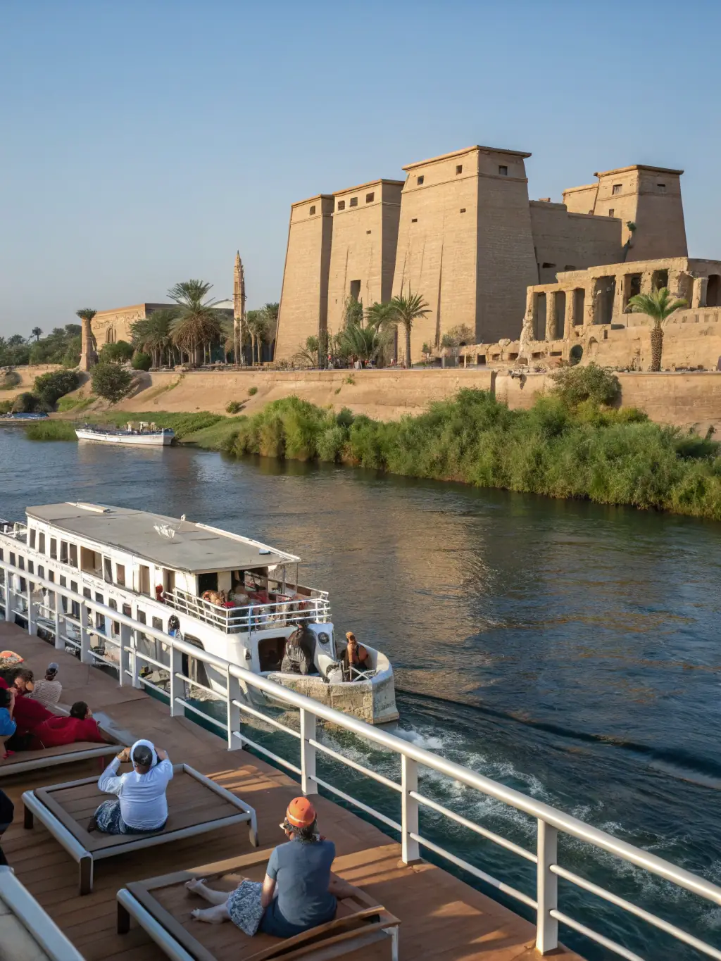 A captivating photo of an Egyptian river cruise, featuring the iconic Nile River, ancient pyramids, and luxurious onboard amenities.