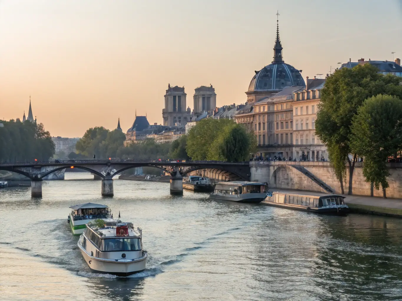 A picturesque view of the Seine River in Paris, with the Eiffel Tower in the background. A river cruise ship is gently sailing on the river, and the city lights are twinkling.